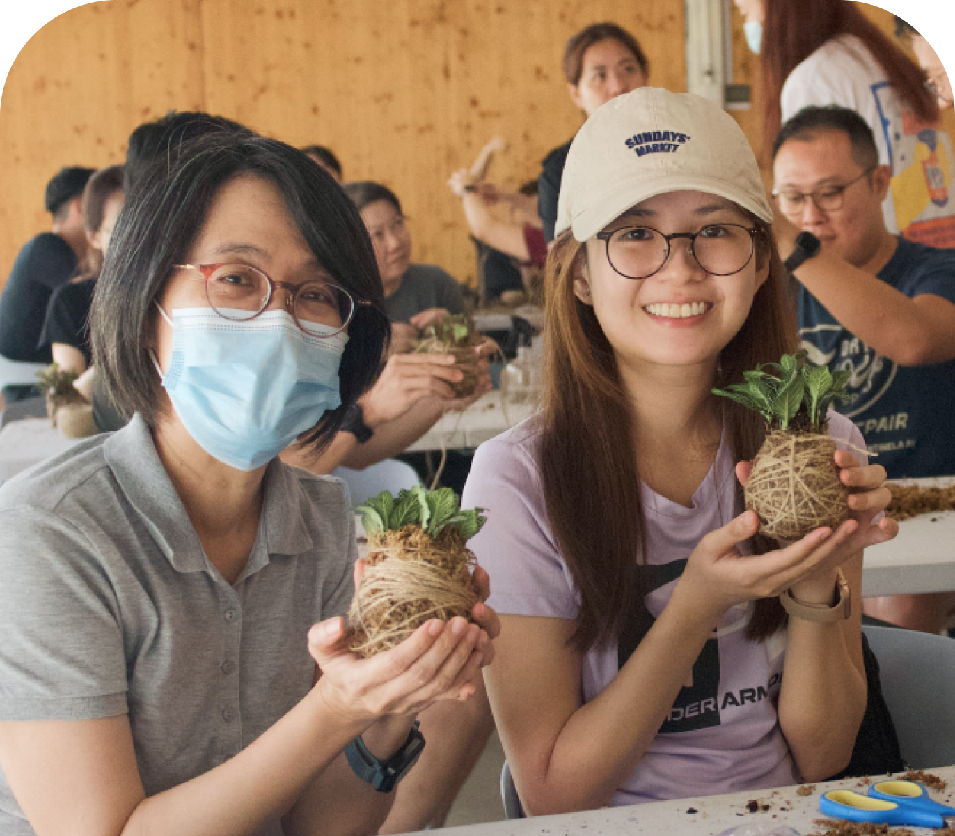 Corporate participants enjoying a hands-on nature-based workshop at City Sprouts