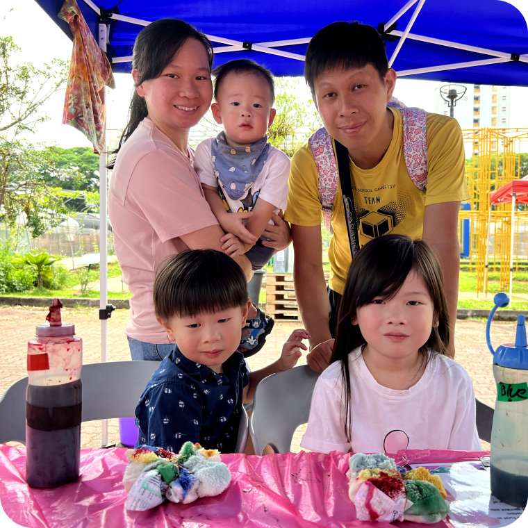Families exploring a City Sprouts urban farm during a company family day